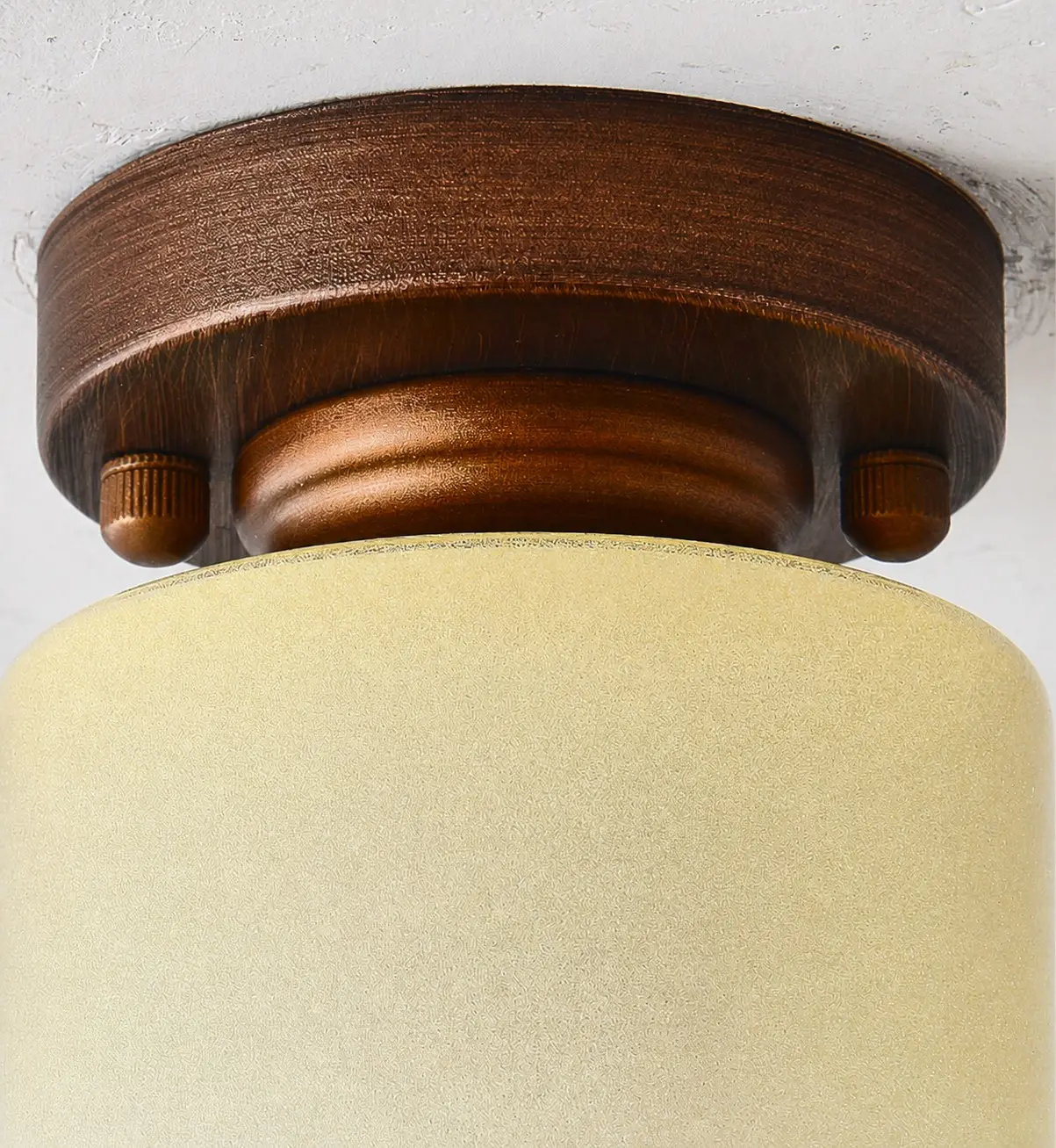 Close view of the antique bronze ceiling base